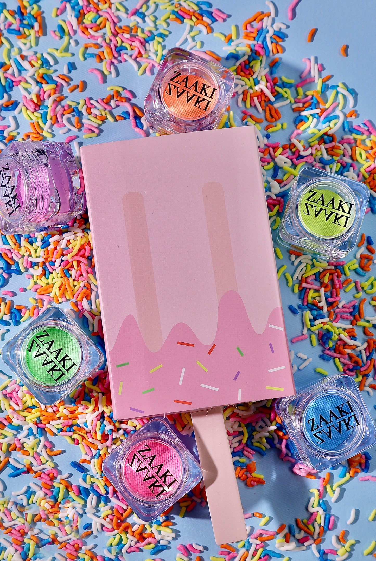 Pastel water activated eyeliner collection. Vibrant eyeliners. Side angle. Colorful pastel eyeliners in an ice cream theme box